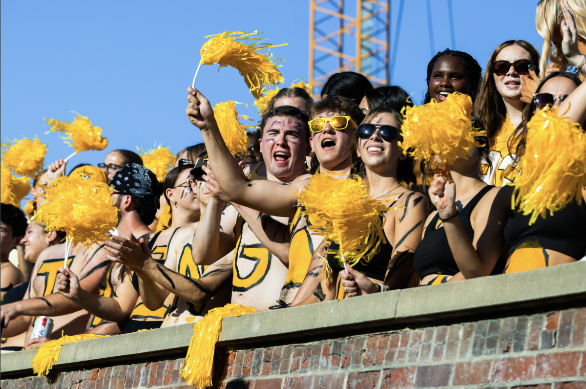 Missouri students cheer as the Mizzou football team warms up on Faurot Field before the game against Central Arkansas on Thursday, Aug. 28, 2025 in Columbia, Mo. The student section was a part of the 57,321 fans in the sold-out crowd in Memorial Stadium Thursday night.
