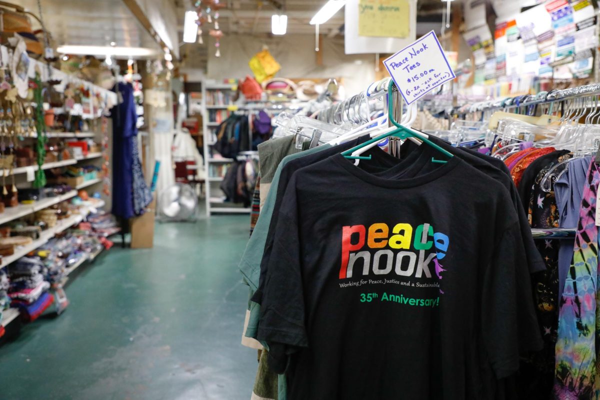 A t-shirt hangs on a rack.