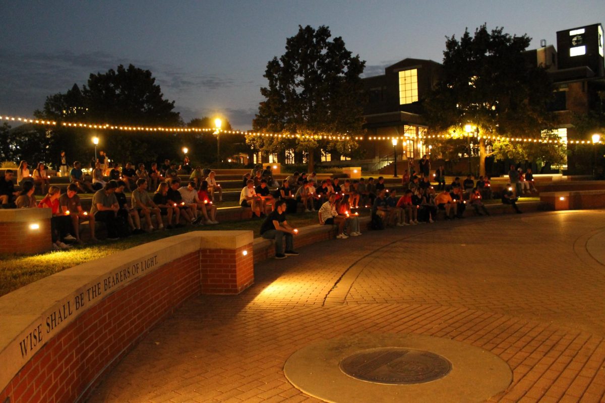 Mizzou students hold candles in Traditions Plaza on Wednesday, Sept. 10, 2025, in Columbia, Mo. MU students gathered to honor the life of conservative speaker Charlie Kirk in a candlelit vigil.