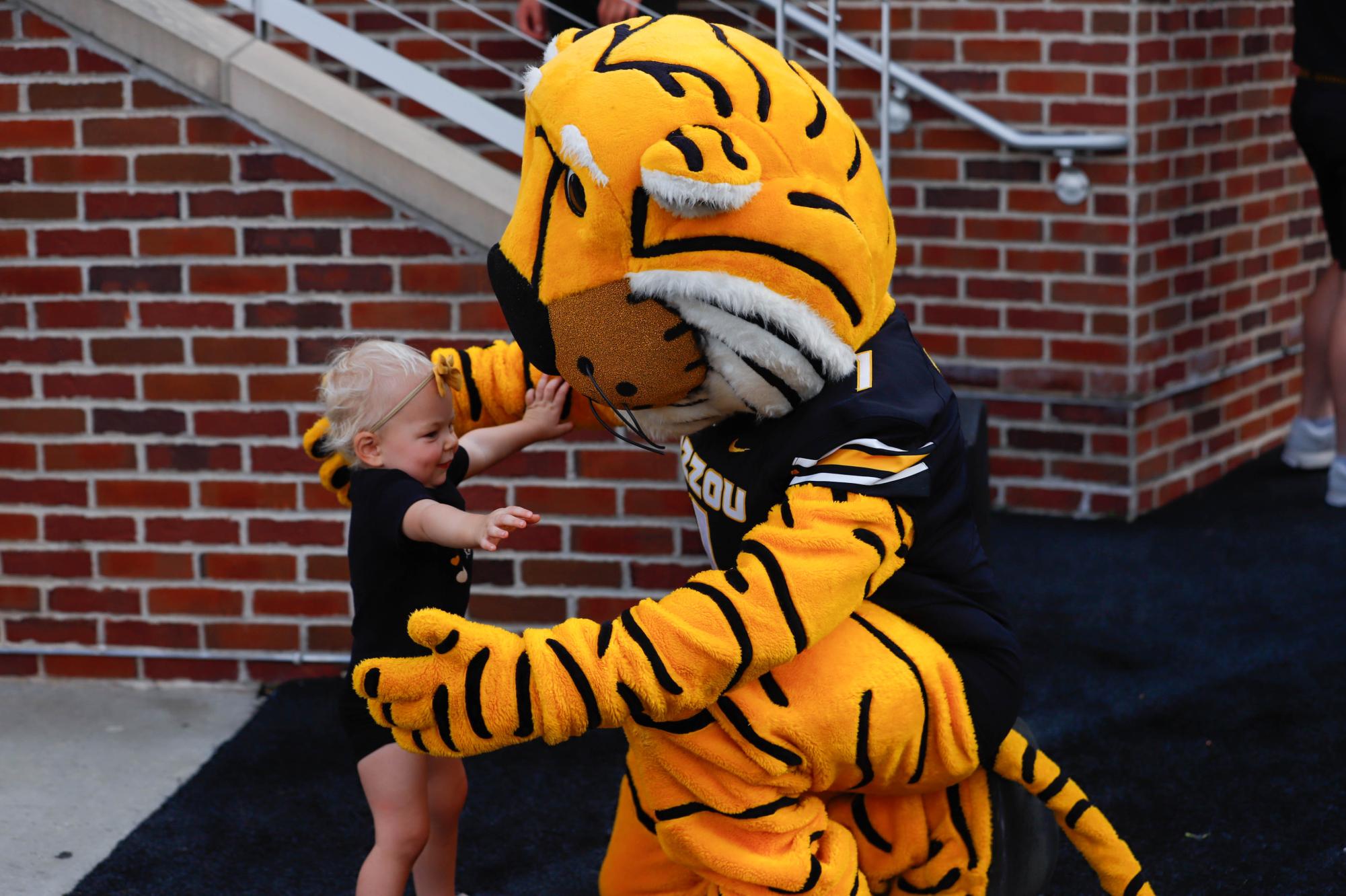 Ester Bogner hugs Truman the Tiger prior to Missouri’s game against South Carolina on Saturday, Sept. 20, at Faurot Field in Columbia, Mo. Truman turned 39 years old on Sept. 13.