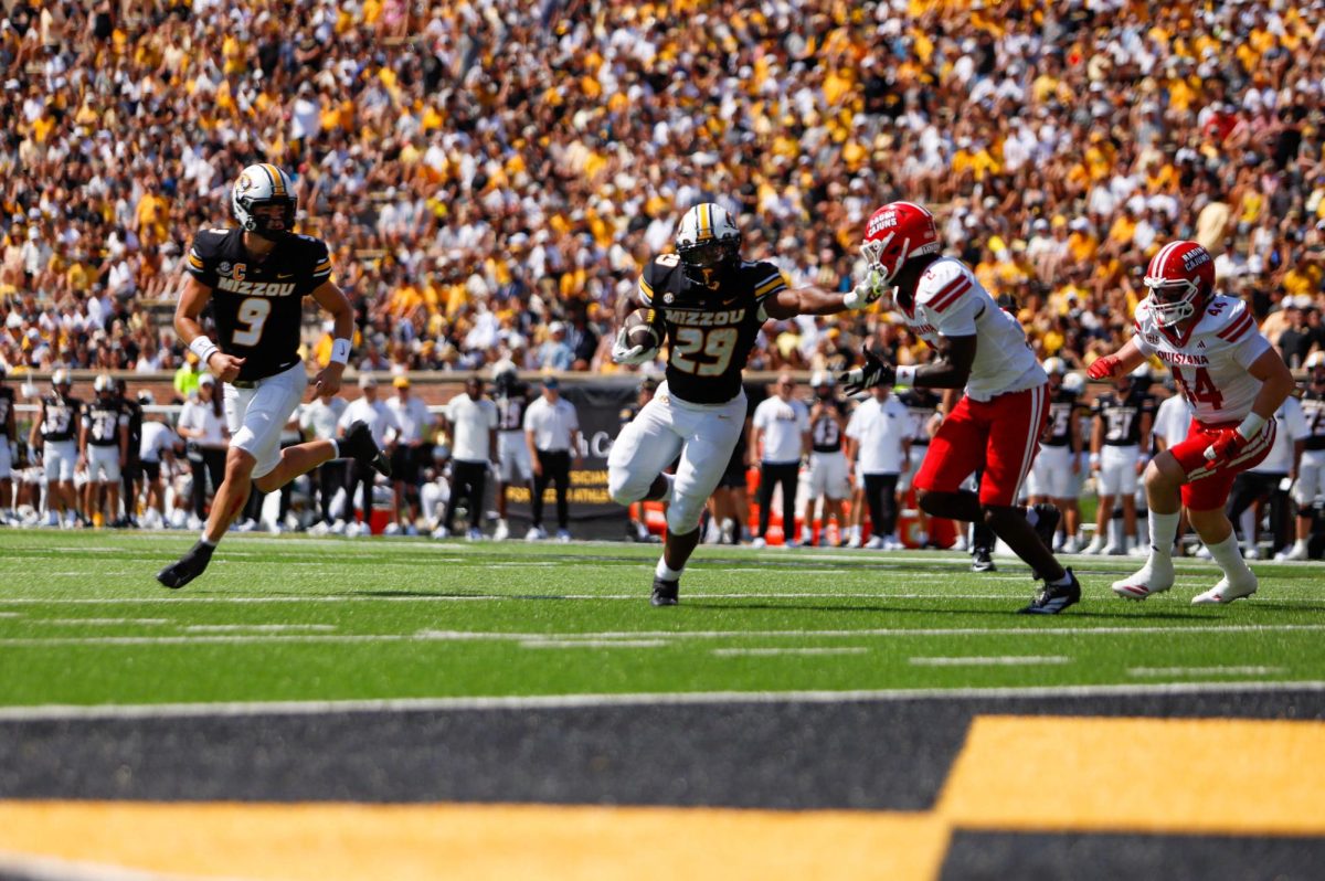 Missouri running back Ahmad Hardy pushes away from defense in a game against Louisiana-Lafayette on Saturday, Sept. 3, 2025, at Faurot Field in Columbia, Mo. Missouri scored a touchdown in every quarter, with two in the second.