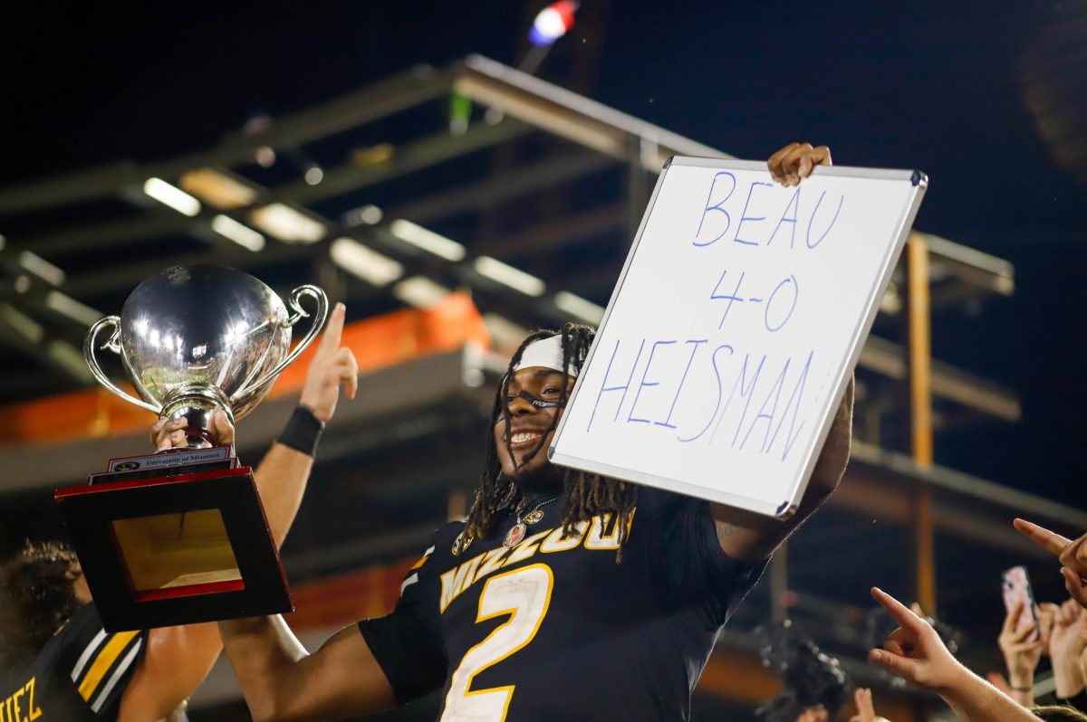 Missouri wide receiver Marquis Johnson smiles and holds up the Mayors Cup and a sign saying “Beau 4-0 Heisman” after winning against South Carolina on Saturday, Sept. 20, at Faurot Field in Columbia, Mo. Memorial Stadium had 57,531 fans in attendance. 