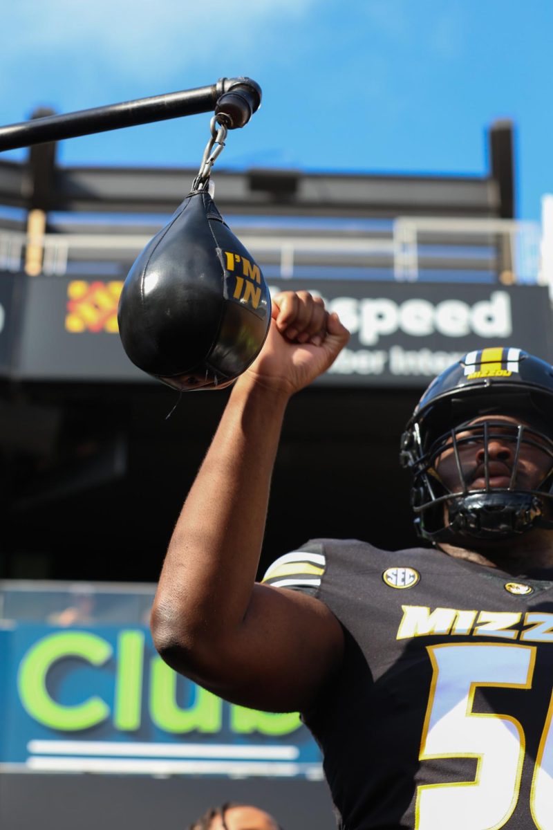 Missouri offense lineman Jaylen Early hits the punching bag while running out of the tunnel before the game against Alabama on Saturday, Oct. 11 at Faurot Field in Columbia, Mo. Faurot was home to SEC Nation once again, coming back for the second time this season. (Sarah Durbin/The Maneater) 