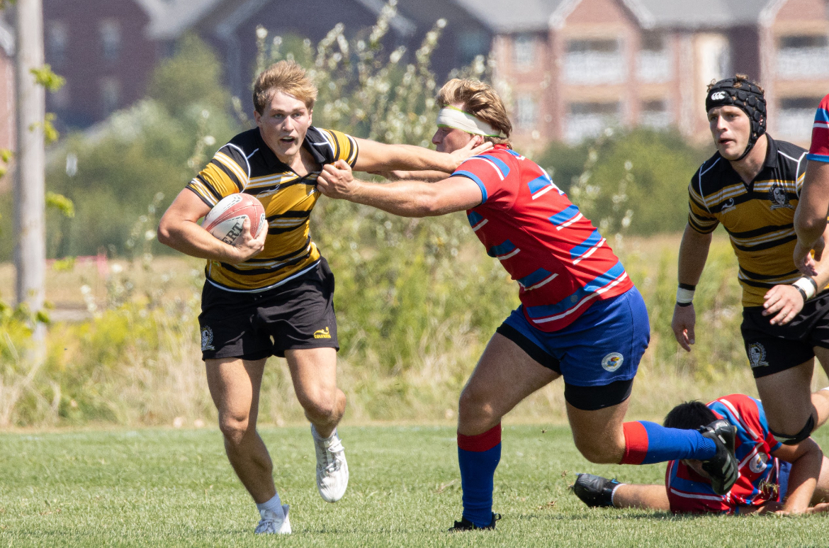 Missouri senior and inside center Drew Blomquist fights off a tackle on Saturday, Sept. 6 at Gans Creek Recreation Area in Columbia, Mo.