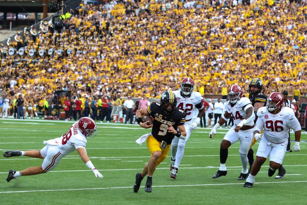 Missouri quarterback Beau Pribula escapes the tackle by Alabama defensive back Bray Hubbard,as he goes in for the touchdown during the game against Alabama on Saturday, Oct. 11 at Faurot Field in Columbia, Mo. Pribula challenged the tide score board, making the game even at 17-17. 