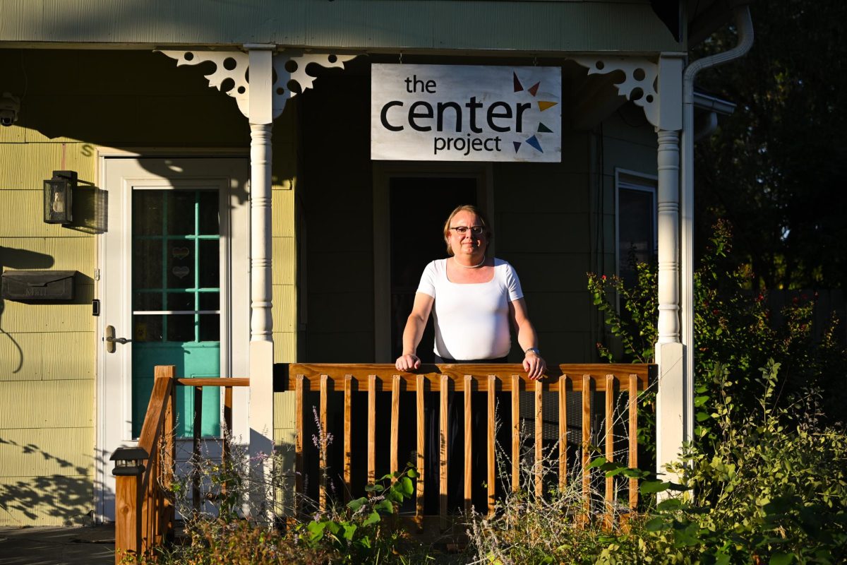 Jaye Trotter stands on the front porch of the Center Project house on Thursday Oct. 16 in Columbia, Mo. The Center Project is a converted house that serves as a resource center for the LGBTQ+ community in Mid-Missouri.