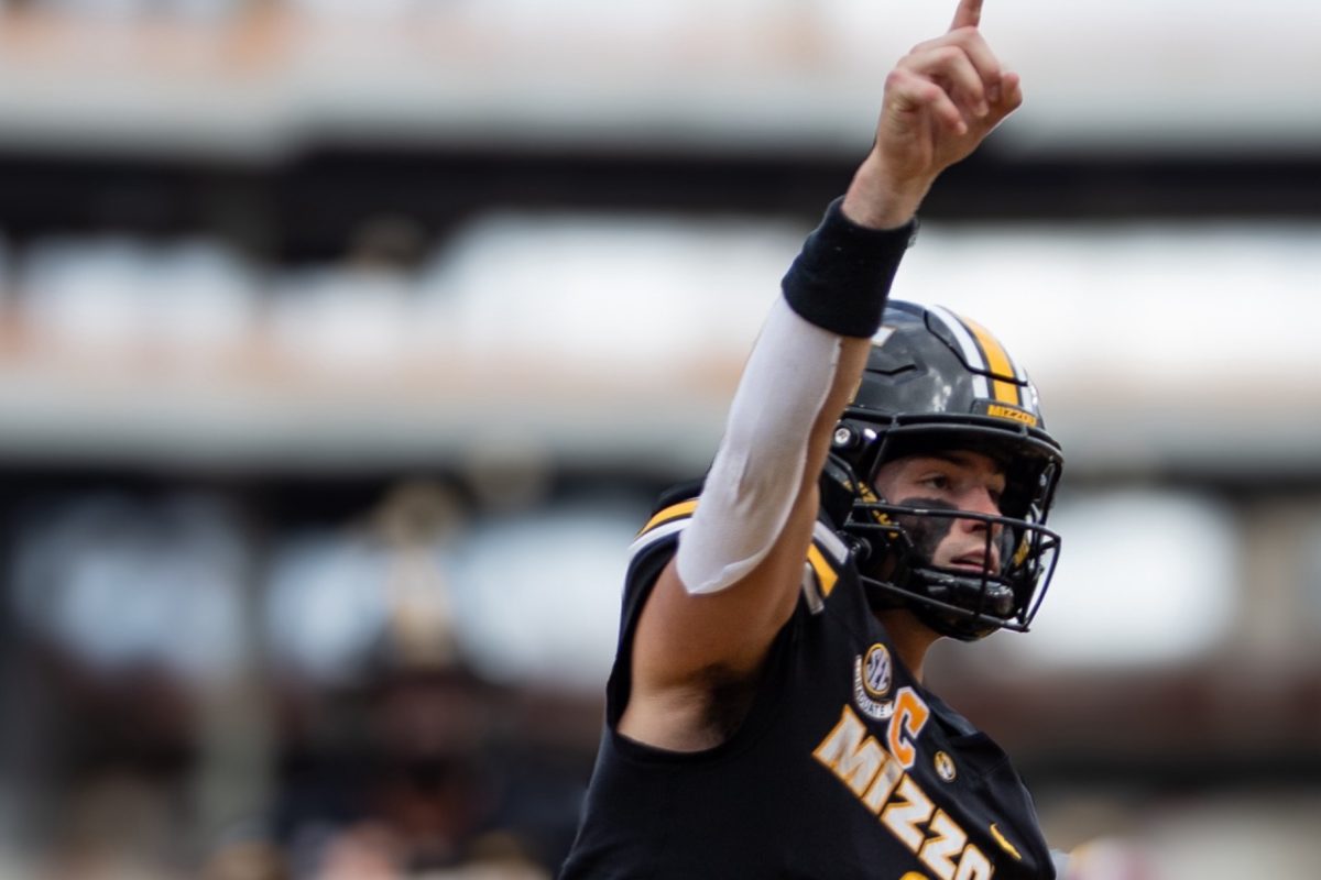Missouri quarterback Beau Pribula holds up his pointer finger after scoring a touchdown during Missouri’s game against Alabama on Saturday, Oct. 11 at Farout Field in Columbia, Mo. Pribula threw for 167 passing yards, with one rushing and two passing touchdowns. 