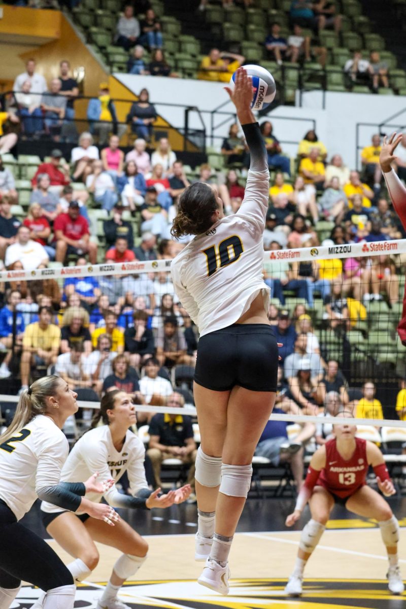 Right side hitter Maca Lobaglio, jumps into the air for a kill during the game
against Arkansas on Friday, Oct. 3 at the Hearnes Center, in Columbia, Mo. Lobaglio had a total of 3 spikes and 3 kills for this match and Missouri went on to win the match, 3-0.