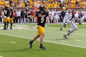  Missouri quarterback Beau Pribula rolls out of the pocket winding up his arm for a pass while facing Alabama on Saturday, Oct. 11 in Columbia, Mo. Pribula passed for 167 yards and two touchdowns throughout four quarters of play. 