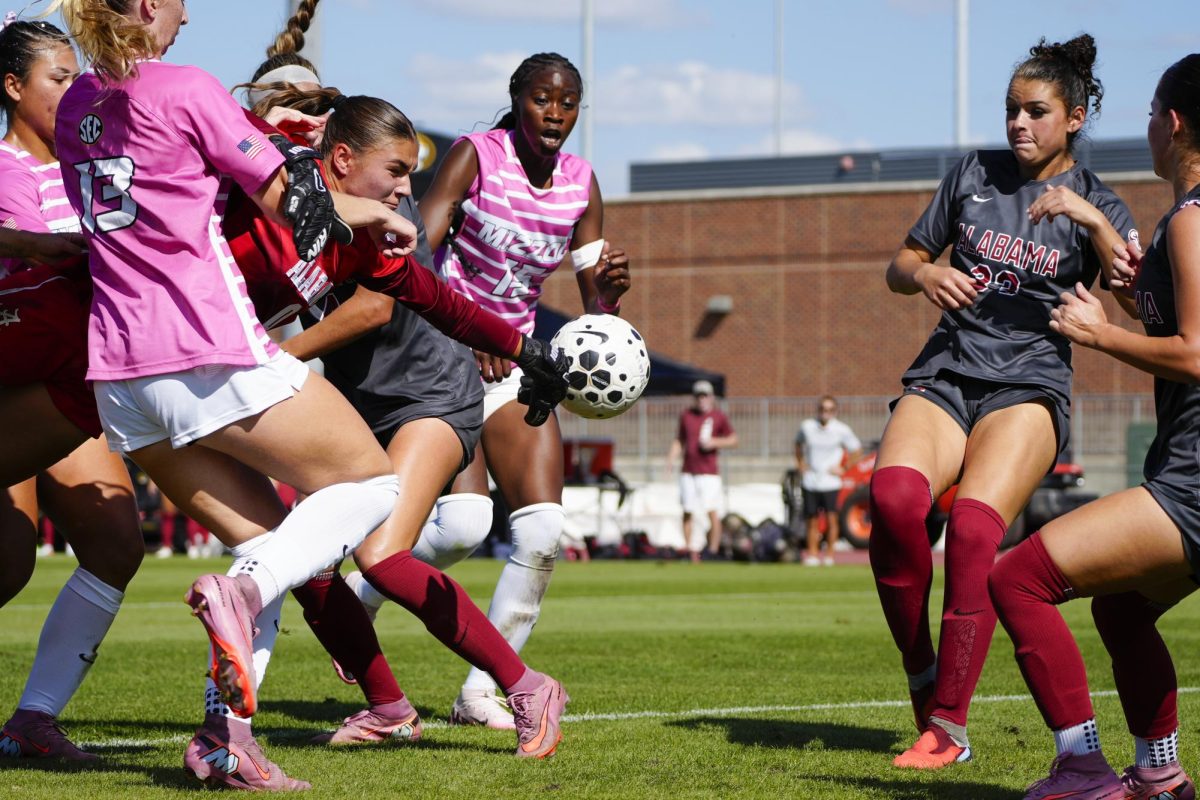  Alabama goalkeeper Madi Munguia dives for the ball amid a group of Missouri players during a match on Sunday, Oct. 5 at Audrey J. Walton Soccer Stadium in Columbia, Mo.