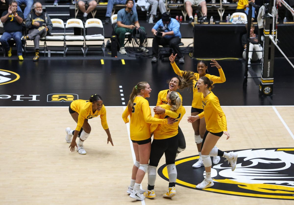 Missouri’s volleyball team celebrates a point gathering in a huddle during the game against Georgia on Sunday, Oct. 26 at Hearnes Center in Columbia, Mo.