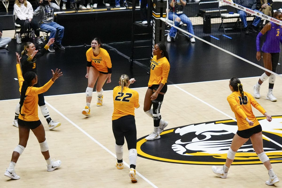 The Missouri volleyball team celebrates after scoring a point during the match against Louisiana State on Sunday, Oct. 19 at the Hearnes Center in Columbia, Mo.