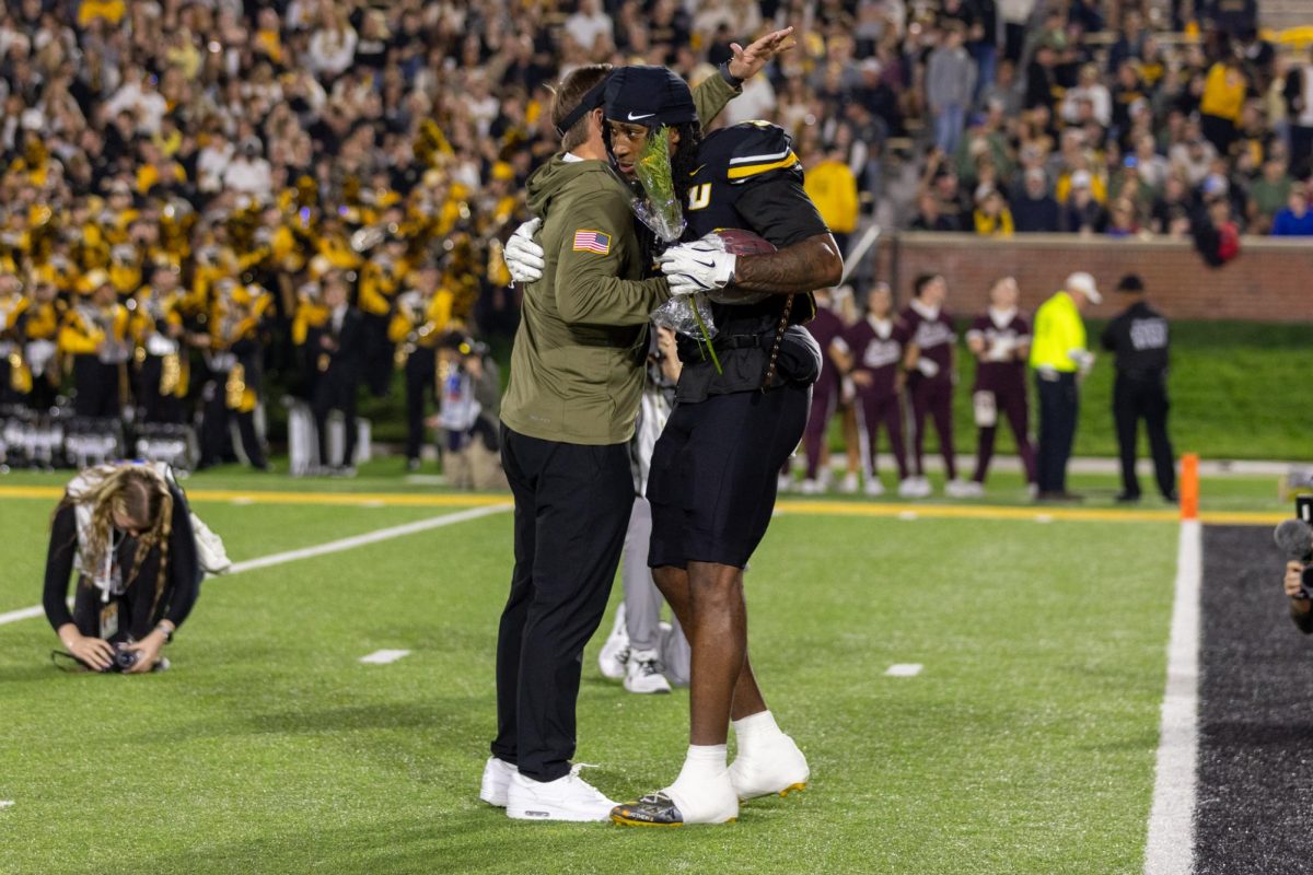 Missouri linebacker Khalil Jacobs hugs head coach Eliah Drinkwitz during senior night celebrations on Saturday, Nov. 15 at Faurot Field in Columbia, Mo. Jacobs had his best game of the season so far, finishing with 10 tackles.