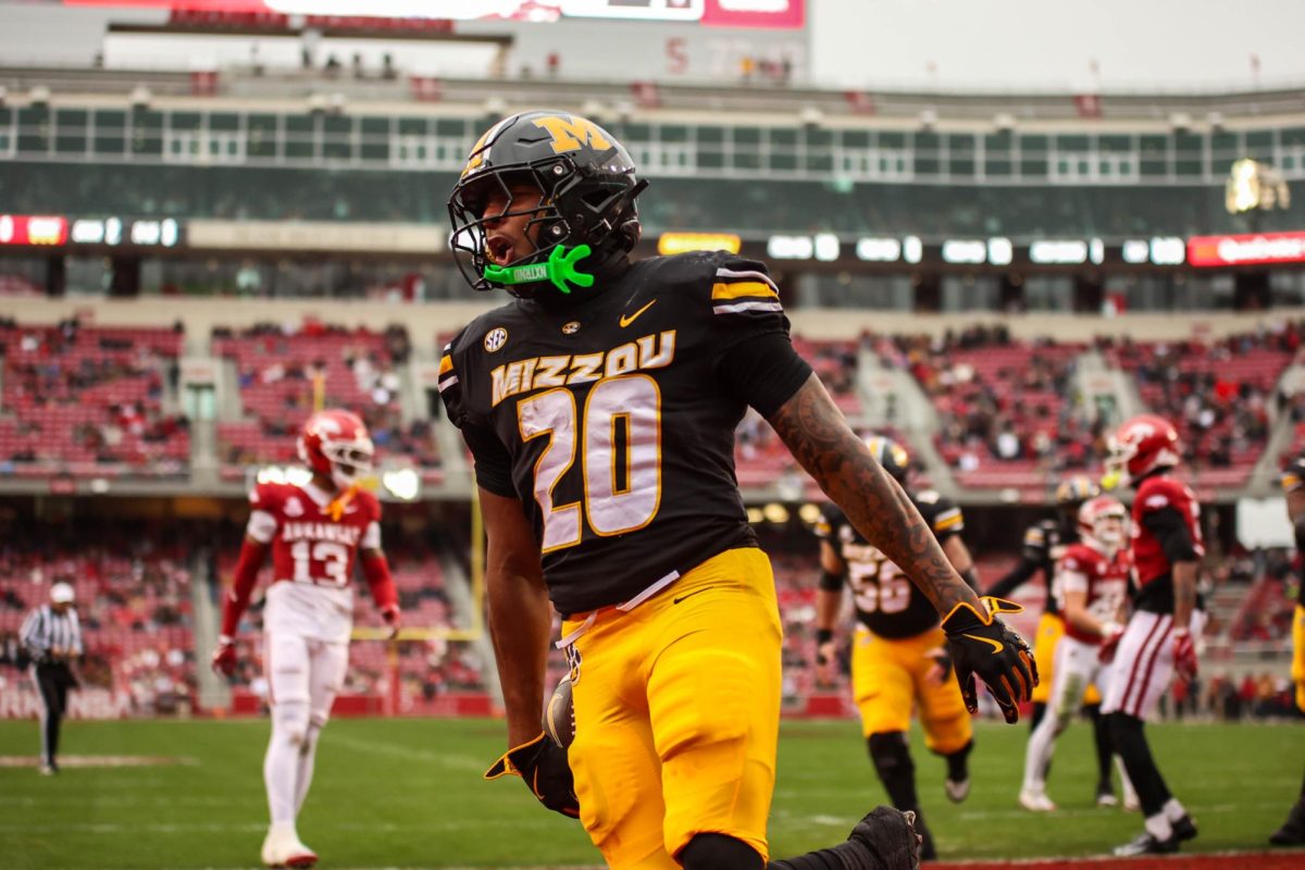 Missouri running back Jamal Roberts celebrates in the end zone after scoring against Arkansas on Nov. 29 in Fayetteville, Ark. Roberts started off the Tigers’ scoring with a four-yard rush early in the first quarter.