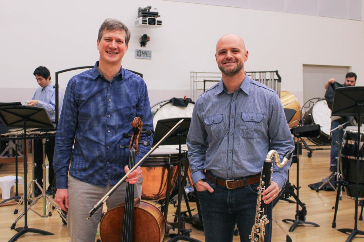 University of Missouri faculty members, Stefan Freund and Bill Kalinkos, pose with a cello and clarinet on Jan. 23, in the Sinquefield Music Center in Columbia, Mo. Freund and Kalinkos are both founding members of Grammy nominated Alarm Will Sound.