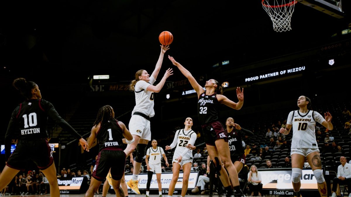 Missouri guard Grace Slaughter shoots over Lauren Ware on Sunday, Jan. 26 at Mizzou Arena in Columbia, Mo. Slaughter led the team with 11 free throws and a total of 24 points.