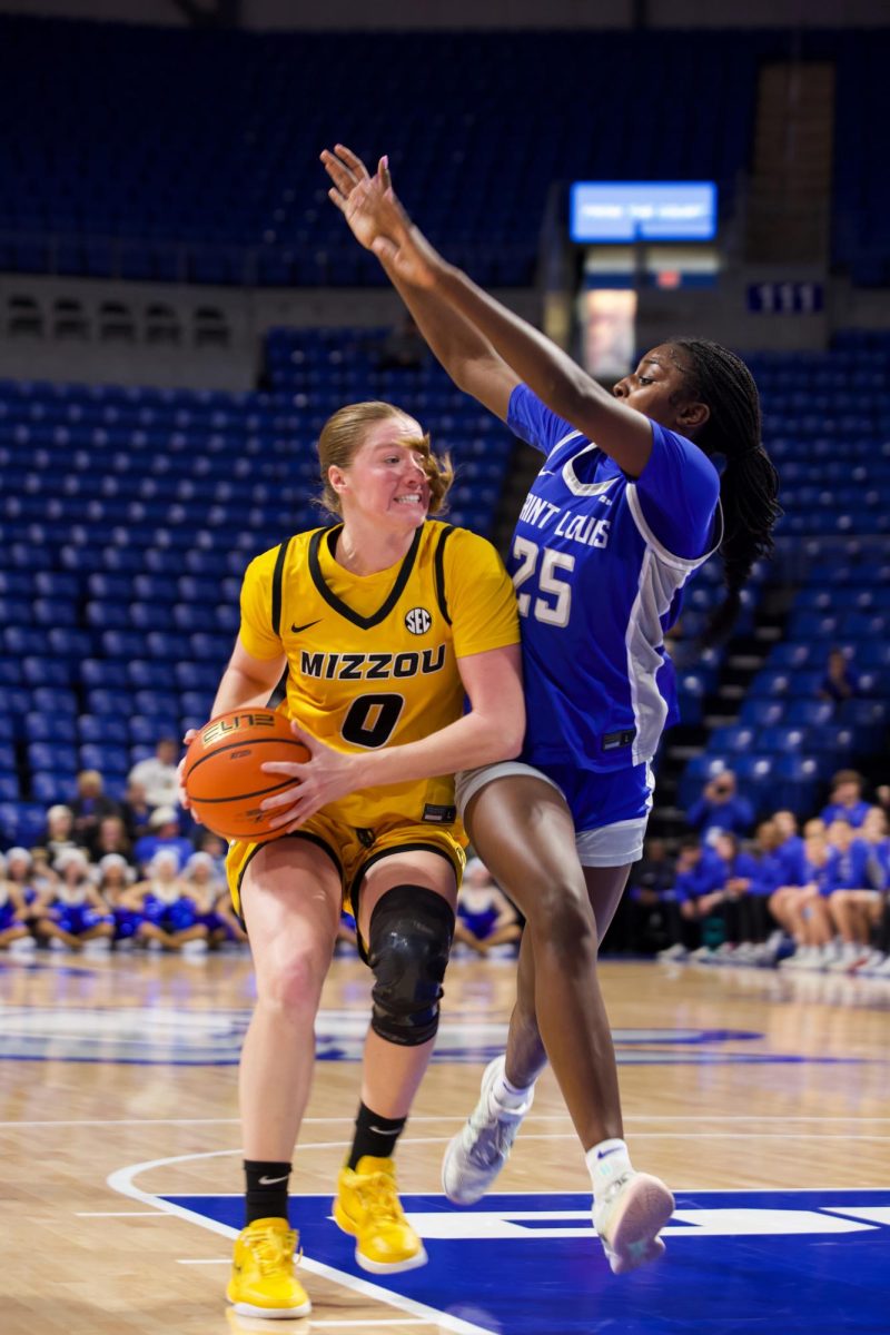 Missouri guard Grace Slaughter tries to make a layup with a SLU defender guarding her, on Tuesday, Dec. 14 at Chaifetz Arena in St. Louis Mo. Slaughter scored 16 points during the game.