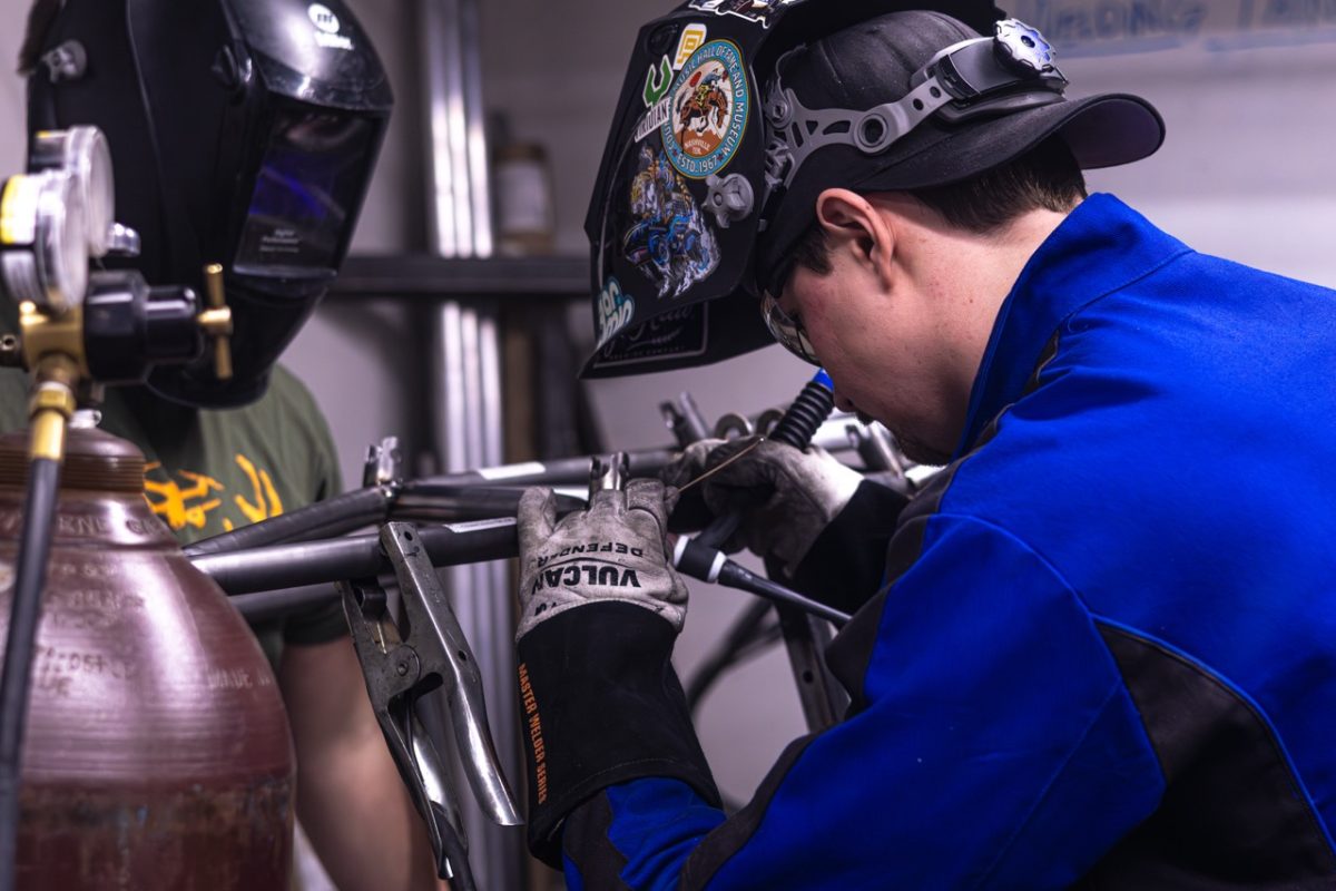 A Mizzou Racing team student carefully inspects the welding on the Mizzou Racing vehicle on Tuesday, Feb. 24 at Lafferre Hall in Columbia, Mo. The team consists mainly of engineering students as well as those from other majors. 