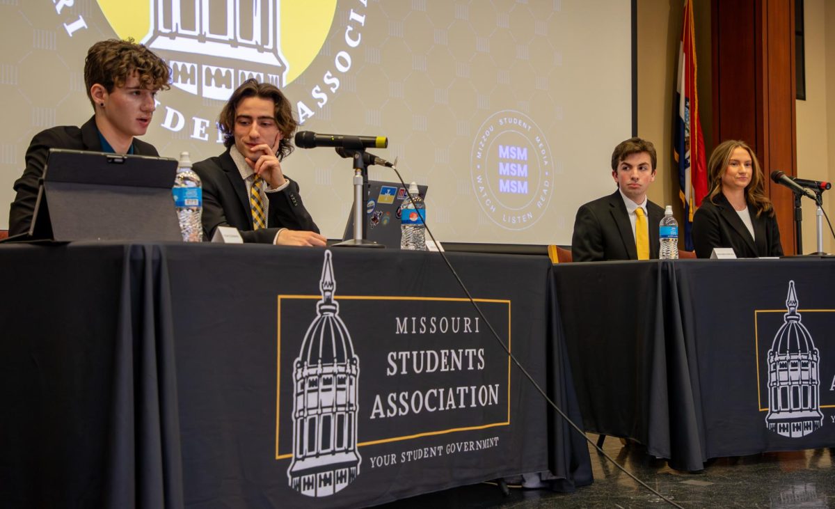 MSA presidential candidate junior Noah Schnarre answers a question while his vice presidential candidate, junior Jase DeCota, listens alongside their opposition, junior Brayden Pirrung and sophomore Elise Lewis on Tuesday, March 16, at Wrench Auditorium in the Memorial Student Union in Columbia, Mo. The debate was held to allow students to hear from the candidates before placing their vote.