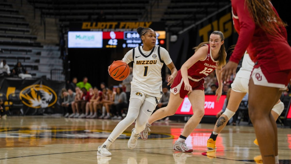 Missouri guard Shannon Dowell dribbles towards the basket in a game against Oklahoma on Sunday, March 1 at Mizzou Arena in Columbia, Mo. The Tigers lost to the Sooners, with a final score of 78-84.