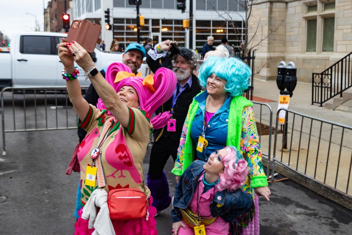 Q Queen Nikki Reese takes a selfie with a group of other queens on Thursday, March 5, at The Sculpture Yard in Columbia, Mo. Many queens work across Columbia, including Reese, who works as an events and business coordinator for The District.