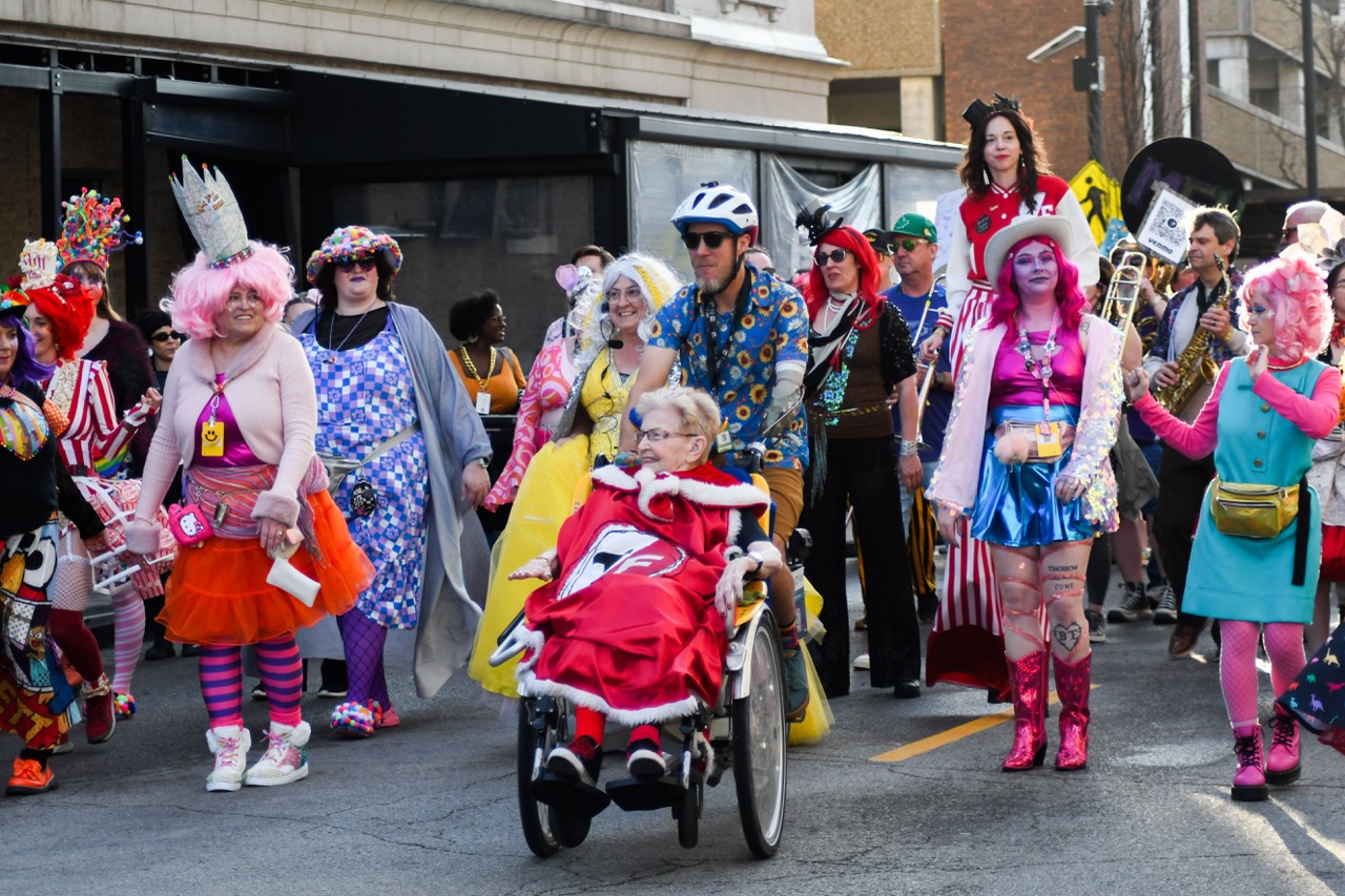 The Q Queens dance down the street during the March March on Friday, March 6 in Columbia, Mo. This year, there were 23 Q Queens, ranging from 17 to 86 years old. 