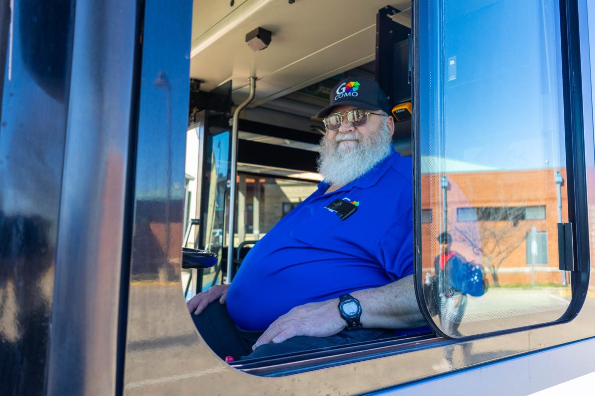 Lewis Mountain sits in the driver's seat of a bus on Wednesday, March 18 at the Wabash Bus Station in Columbia, Mo. Lewis got his chauffeurs license at 18 years old and has been driving buses ever since.