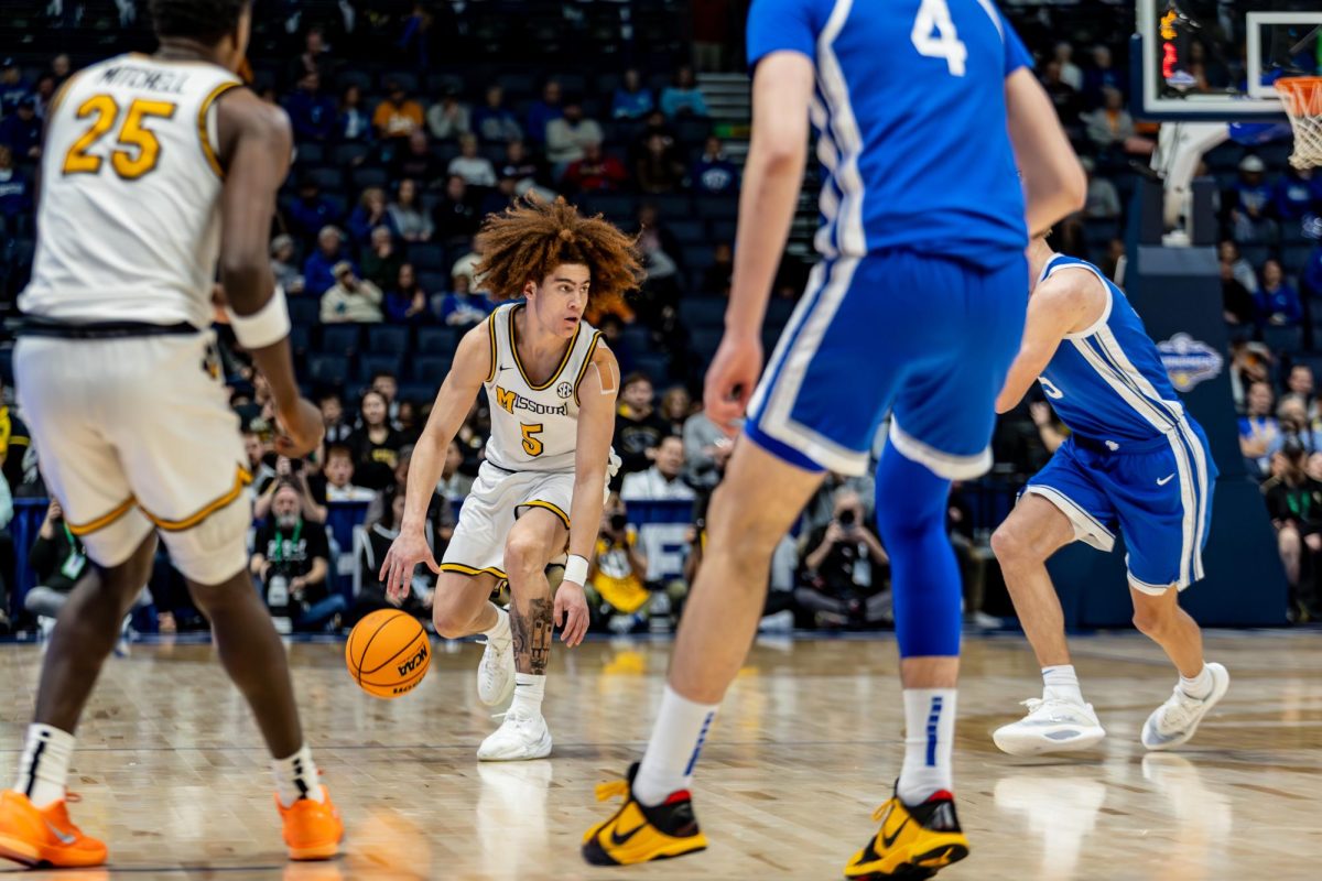 Missouri guard Jayden Stone looks for an open teammate in a game against Kentucky on Thursday, March 12, at Bridgestone Arena in Nashville, Tenn.