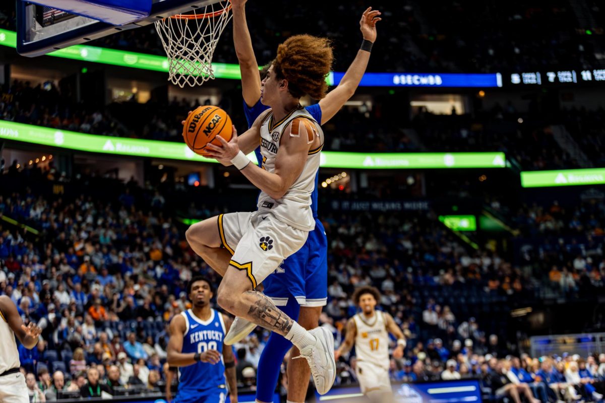 Missouri guard T.O. Barrett  attempts to shoot in a game against Kentucky on Thursday, March 12, at Bridgestone Arena in Nashville, Tenn.