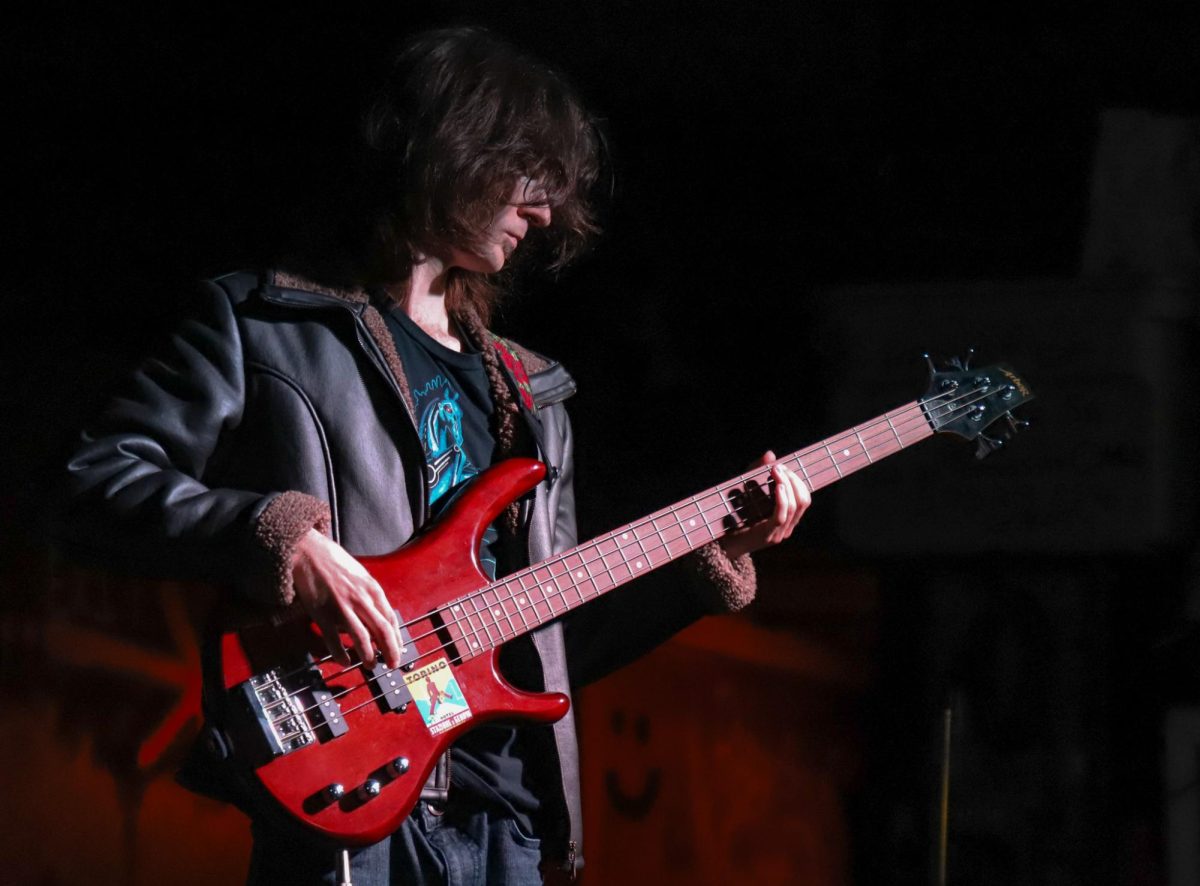 Coscoroba’s bassist, Colt Meinershagen, plays his bass guitar while performing with his band for the LBC benefit at PDM in Columbia, Mo., on April 24. After reaching out to the Columbia Crowdkiller and asking to play for the event, the band performed their first live set.