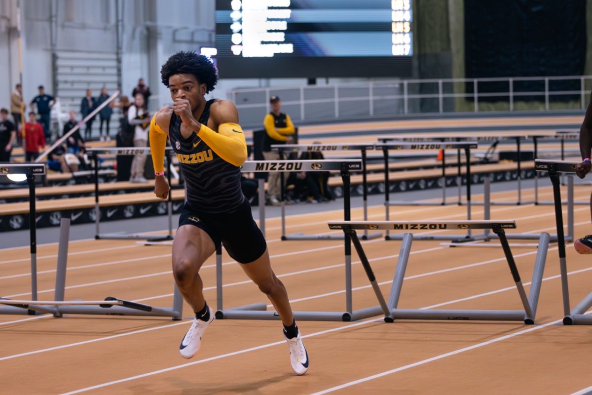 Missouri sprinter Dillon Leacock races towards the final hurdle during the 60m hurdles on Saturday, Jan. 30 at Hearnes Center Fieldhouse in Columbia, Mo. Leacock beat his personal record completing the race in 8.09 seconds.